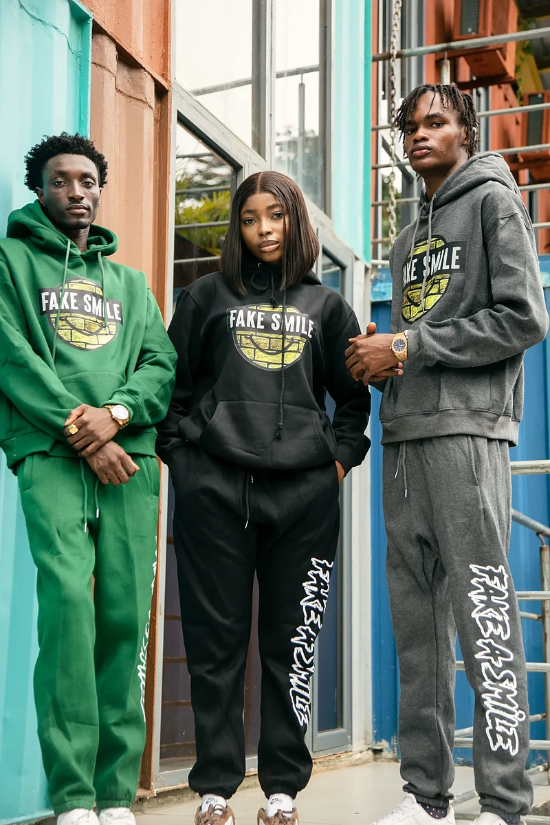 FakeSmile crew lookbook shot — models wearing the current drop in Lagos